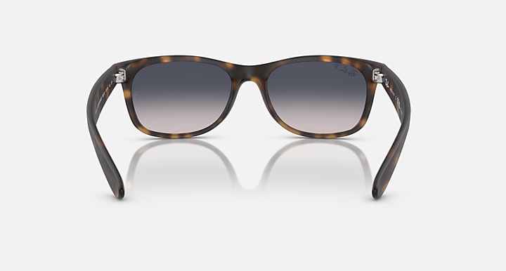 Ray-Ban RB2132 Wayfarer sunglasses, tortoise frame, dark lenses, front view