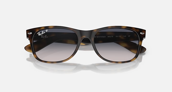Ray-Ban RB2132 Wayfarer sunglasses, tortoise frame, dark lenses, centered front view