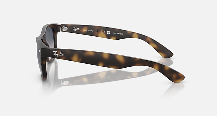 Ray-Ban RB2132 Wayfarer sunglasses, tortoise frame, dark lenses, temple side view