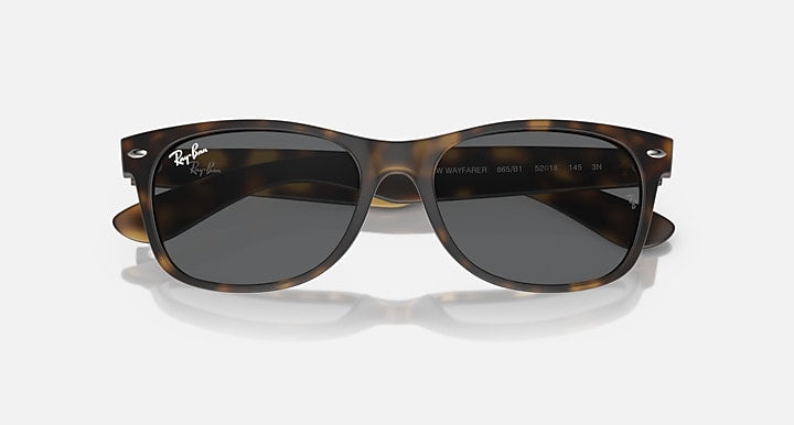 Ray-Ban RB2132 Wayfarer sunglasses, tortoise frame, dark lenses, front close view