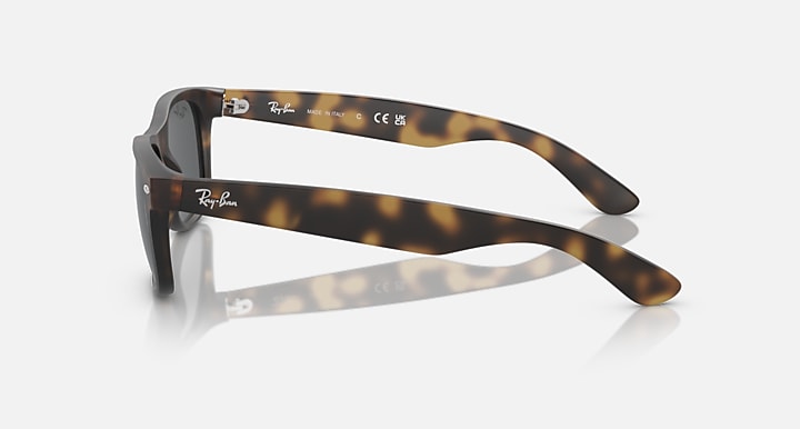 Ray-Ban RB2132 Wayfarer sunglasses, tortoise frame, dark lenses, other temple view
