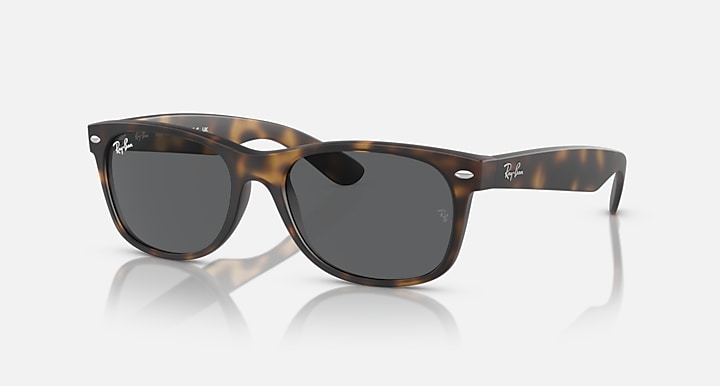 Ray-Ban RB2132 Wayfarer sunglasses, tortoise frame, dark lenses, profile angled view