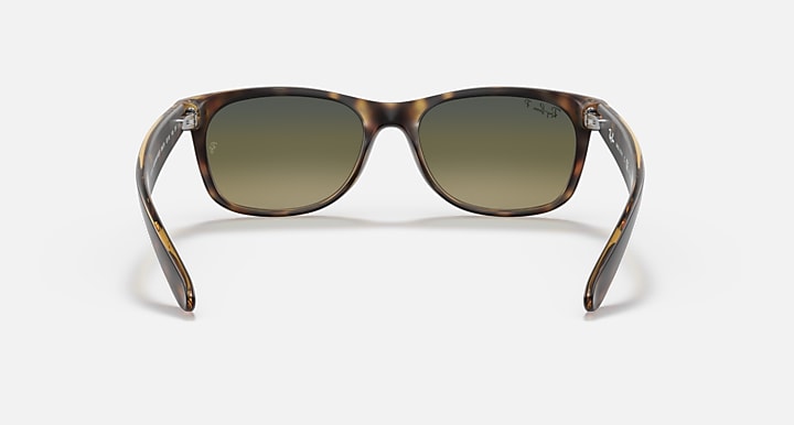 Ray-Ban sunglasses with clear-tortoise frame and olive lenses, front view