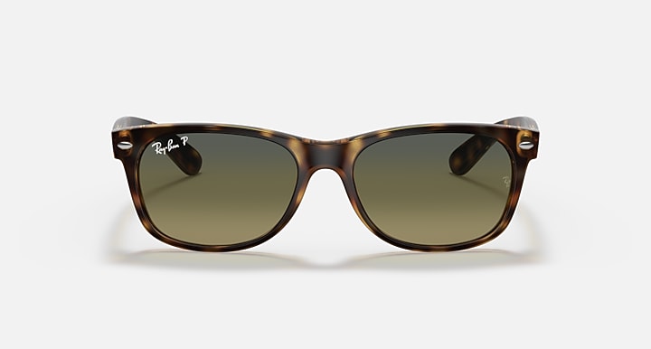 Ray-Ban sunglasses with tortoise frame and dark olive lenses, classic Wayfarer front view