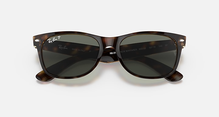 Wayfarer RB2132 sunglasses with tortoise frames and dark tinted lenses
