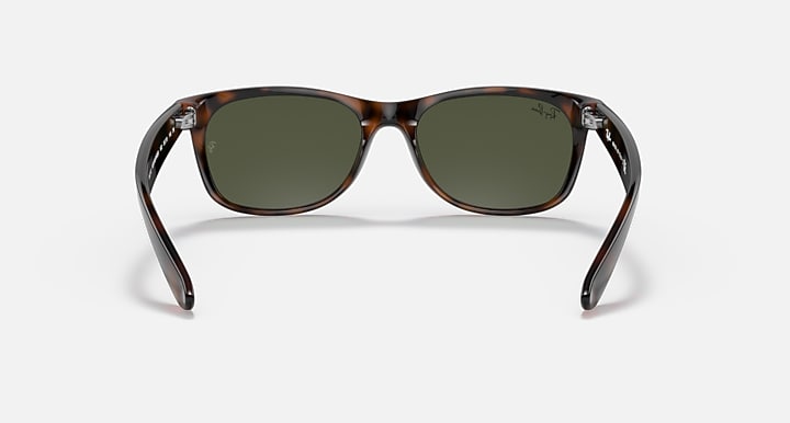 New Wayfarer sunglasses front view, tortoise frame with dark green lenses