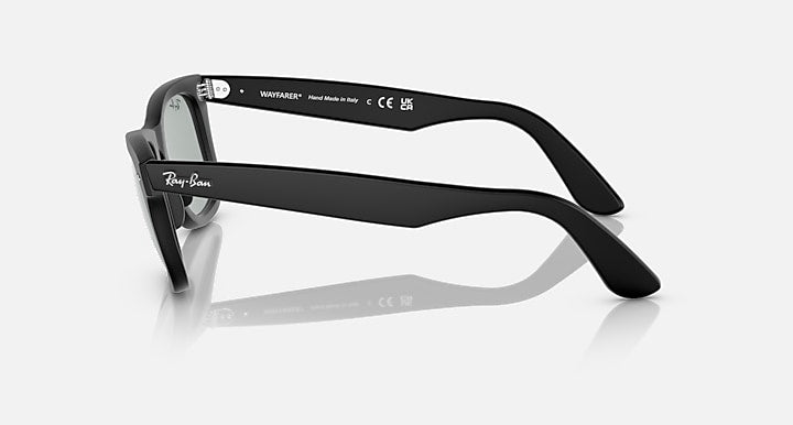 Ray-Ban Wayfarer sunglasses, black frame side profile with light gray lenses