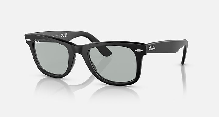 Ray-Ban Wayfarer sunglasses, black frame with light gray lenses, angled view