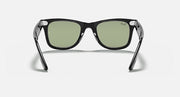 Ray-Ban Wayfarer sunglasses with black frames and green-tinted lenses, front view