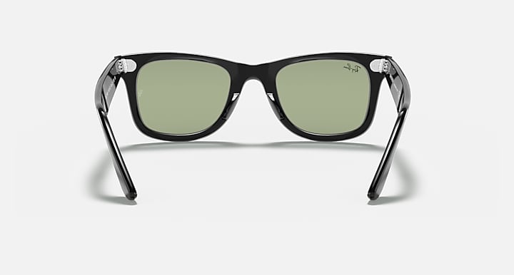 Ray-Ban Wayfarer sunglasses with black frames and green-tinted lenses, front view