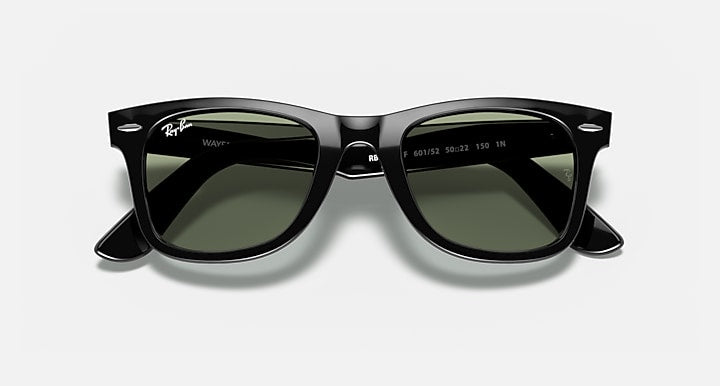 Ray-Ban Wayfarer sunglasses with black frames and green-tinted lenses, close front