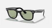 Ray-Ban Wayfarer sunglasses with black frame and green-tinted lenses, angled view.