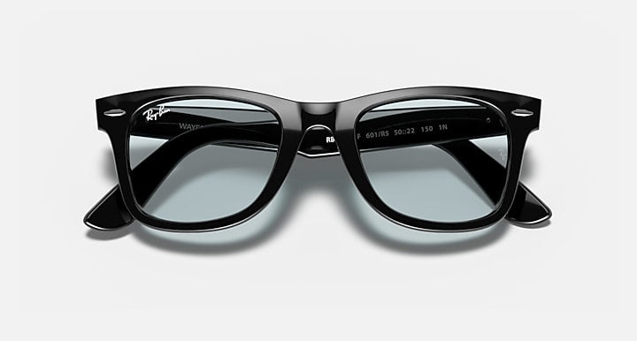 Ray-Ban Wayfarer sunglasses with black frame and tinted light lenses, front close view.