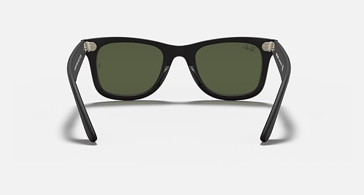 Wayfarer-style sunglasses with dark green lenses and black frame, front with visible arms