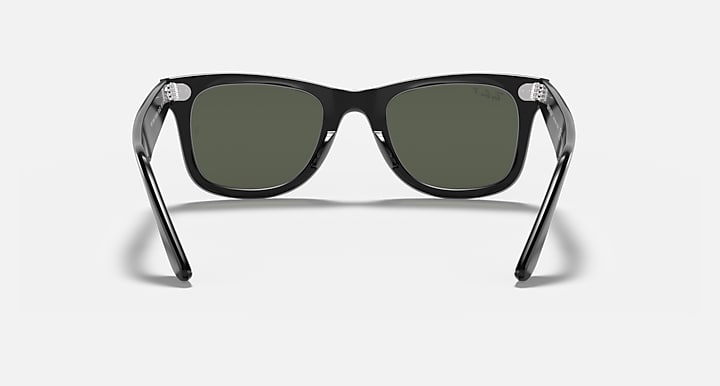 Wayfarer-style sunglasses with dark green lenses and black frame, front view