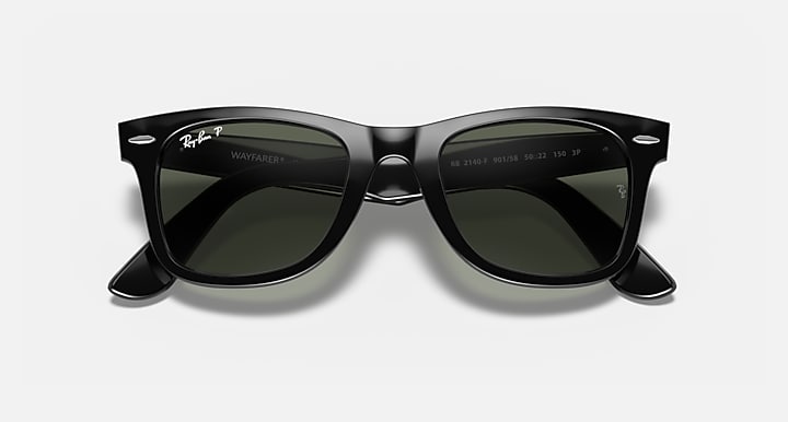 Wayfarer-style sunglasses with dark green lenses and black frame, front view with lens detail