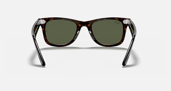 Ray-Ban wayfarer sunglasses, tortoise frame and green tinted lenses, front
