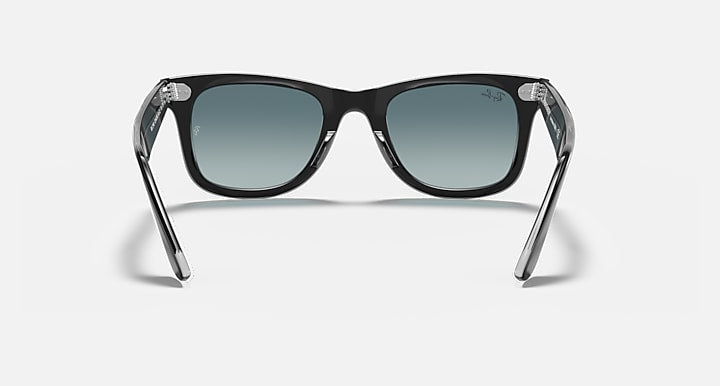 Ray-Ban Original Wayfarer sunglasses with dark frame and teal-tinted lenses, front view