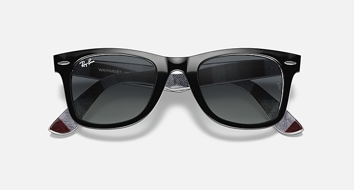 Ray-Ban Wayfarer sunglasses with dark gray lenses and black frame, front with temple tips