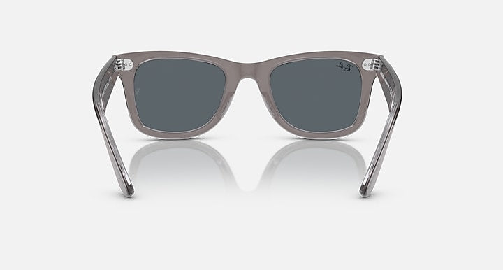 Ray-Ban Wayfarer sunglasses with clear grey frame and dark lenses, front view