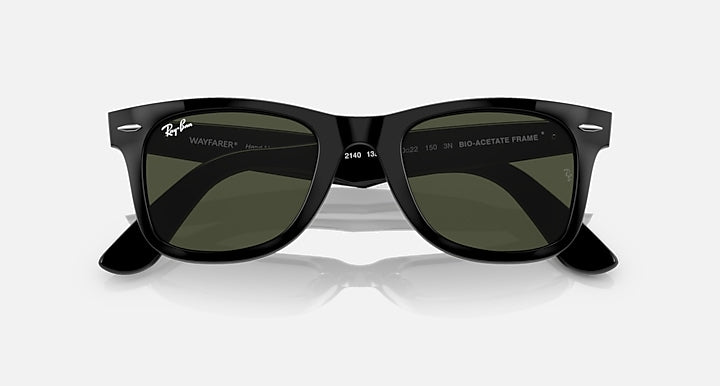 Wayfarer-style sunglasses with black frame, dark lenses, and logo detail