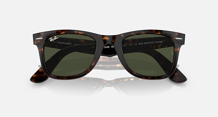 Ray-Ban Wayfarer sunglasses, tortoise frame with dark green lenses and visible branding
