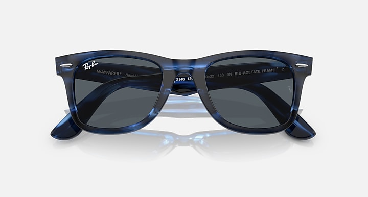 Wayfarer-style sunglasses with dark blue frame and black-tinted lenses, front view