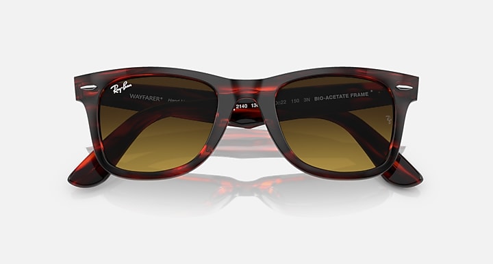 Ray-Ban Wayfarer sunglasses top view, dark amber lenses, red-brown patterned frame