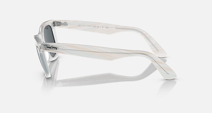 Ray-Ban Wayfarer sunglasses, clear light frame with dark lenses, side view