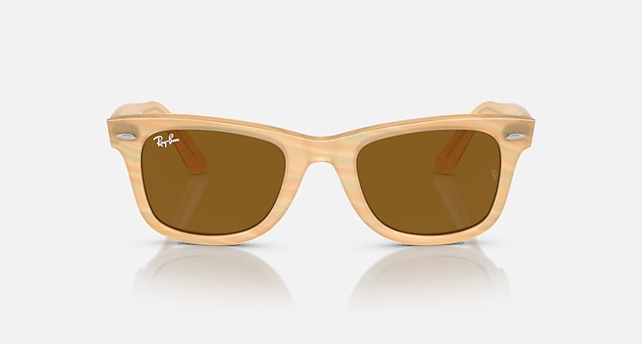 Ray-Ban Wayfarer sunglasses with amber lenses and tan translucent frame, front view