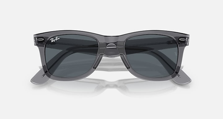 Ray-Ban Wayfarer sunglasses with dark lenses and black frame, angled front view