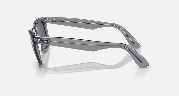 Ray-Ban Wayfarer sunglasses side view with dark gray lenses and translucent dark frame