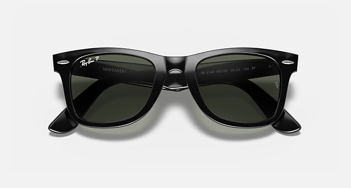 Ray-Ban Wayfarer sunglasses, angled view, black with dark green lenses