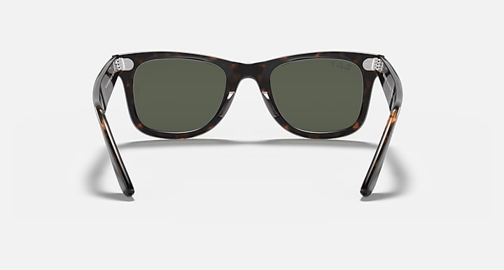 Tortoise Wayfarer sunglasses front view with dark green lenses and thick arms