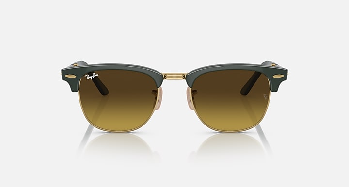 Folding sunglasses with dark green and gold frame, brown gradient lenses, front bar
