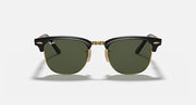 Ray-Ban sunglasses with dark green lenses and black acetate frame, gold bridge accents