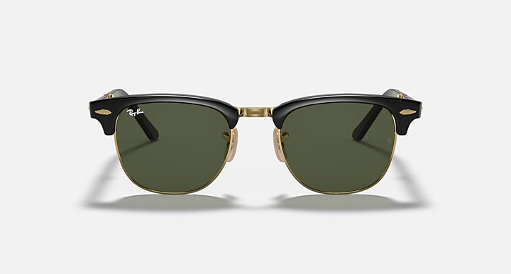 Ray-Ban sunglasses with dark green lenses and black acetate frame, gold bridge accents