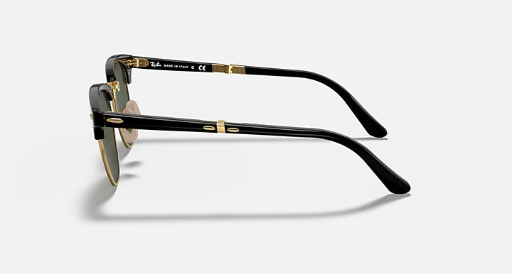 Ray-Ban sunglasses side view: black frame with gold detailing and dark green lens