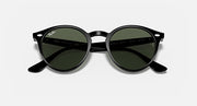 Ray-Ban round sunglasses with dark green lenses, black frame, close-up front