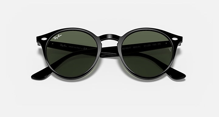 Ray-Ban round sunglasses with dark green lenses, black frame, close-up front