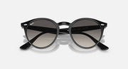 Ray-Ban round sunglasses with black frame and dark-to-light gradient lenses