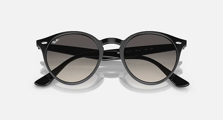 Ray-Ban round sunglasses with black frame and dark-to-light gradient lenses