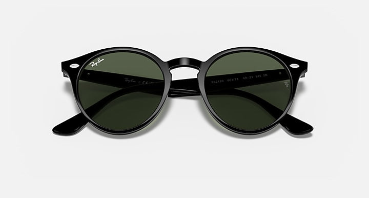 Round sunglasses with black frame and dark green polarized lenses