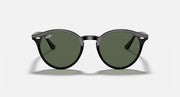 Round sunglasses with black frame and dark green lenses