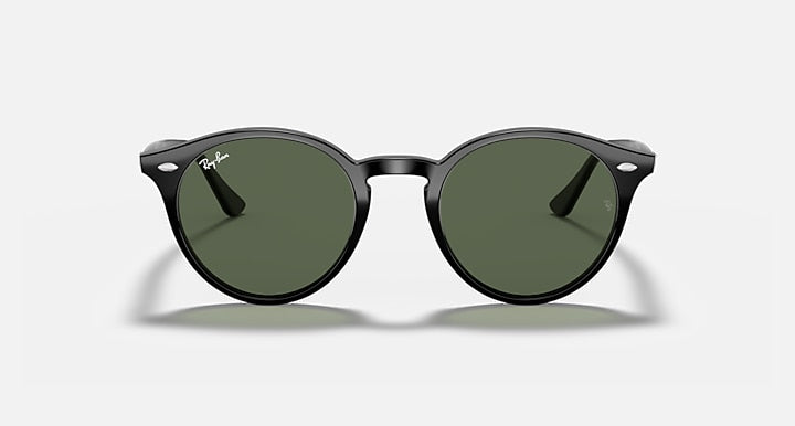 Round sunglasses with black frame and dark green lenses