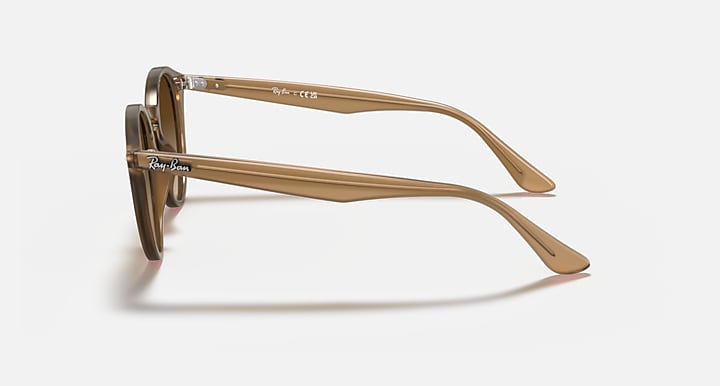 Light brown round sunglasses, side view with brown lenses