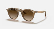 Light brown round sunglasses with brown gradient lenses