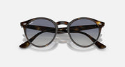 Ray-Ban round sunglasses with dark brown frame and mirrored dark gradient lenses