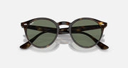 Ray-Ban round tortoiseshell sunglasses with green-tinted lenses and dark metal temples