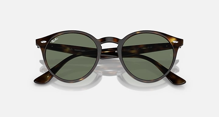 Ray-Ban round tortoiseshell sunglasses with green-tinted lenses and dark metal temples